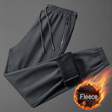 Pantalon / jogging de survêtement en polaire & imperméable "Miloor - 8020 series" - Gris / M | Planète Rando