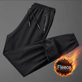 Pantalon / jogging de survêtement en polaire & imperméable "Miloor - 8020 series" - Noir / M | Planète Rando