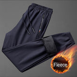 Pantalon / jogging de survêtement en polaire & imperméable "Miloor - 8020 series" - Bleu foncé / M | Planète Rando