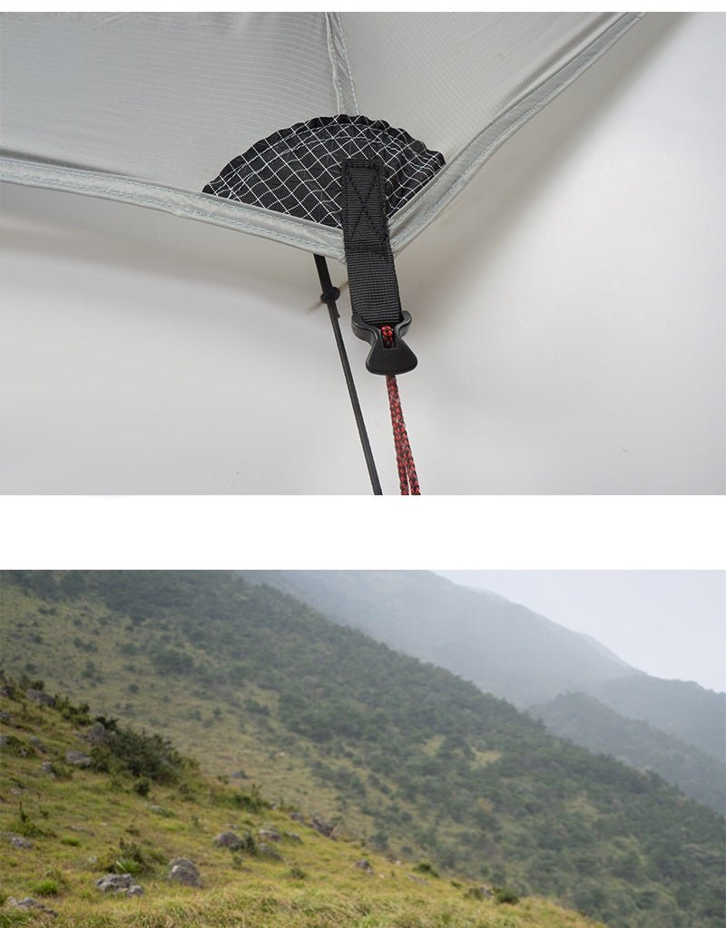 Gros plan sur la tente bivouac ultra-légère d'angle 3F UL GEAR "Lanshan 2 pro", dotée de sangles de tension et d'un cordon pour une ventilation optimale. Ci-dessous, un paysage de colline herbeuse avec des arbres épars sous un ciel couvert.